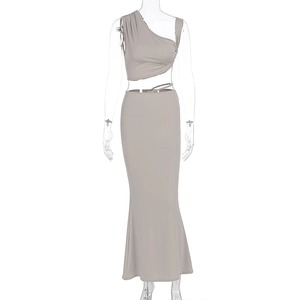 Detail of stone-colored two-piece set featuring a one-shoulder top and high-waist fishtail skirt