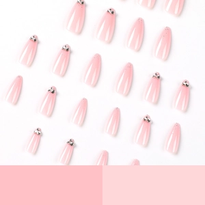 Pink gradient almond press-on nails with silver rhinestones and gold glitter accents