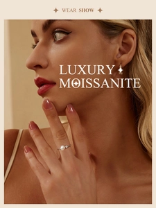 Elegant model wearing 925 sterling silver ring and earrings set with pearl and moissanite