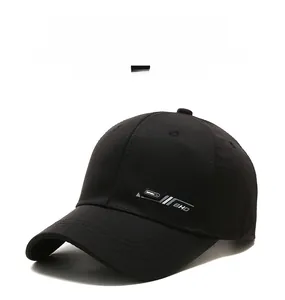 Close-up of black cotton baseball cap showing BHD embroidery and reinforced stitching
