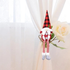 Attache-rideau de Noël gnome avec chapeau rouge et longues jambes rayées