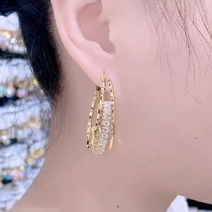 Elegant gold multi-layered hoop earrings with shimmering pave-set zircon stones for women