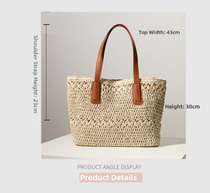 Detail view of woven straw tote bag with size dimensions and brown leather handles