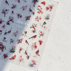 Japanese style red snow bird nail stickers with floral patterns on a clear sheet