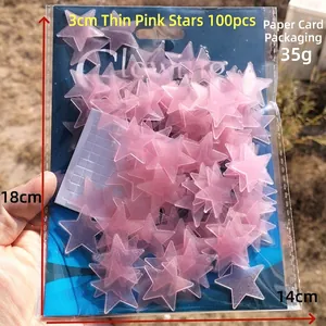Package of 100 pink 3cm glow in the dark star wall stickers with adhesive pads