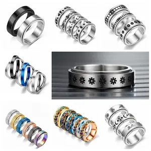 Rotating stainless steel spinner rings for anxiety relief with star and moon patterns