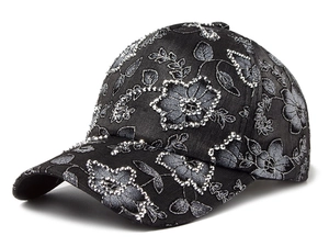 Detailed embroidery of silver flowers and sparkling rhinestones on a black baseball cap