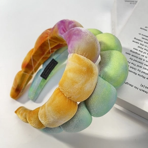 Padded velvet headband with colorful tie-dye gradient design and thick sponge cushioning