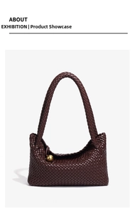 Detail of hand-woven dark brown leather tote with a luxury gold spherical metal ornament