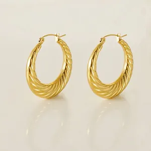 Pair of 18K gold plated twisted croissant hoop earrings with a textured spiral design
