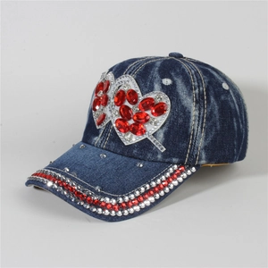 Denim baseball cap featuring red heart rhinestones and a curved brim for casual wear