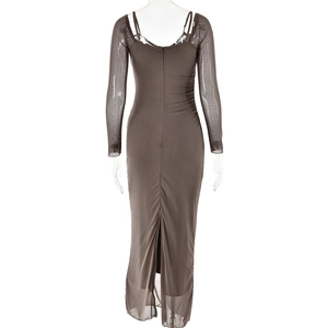 Detail view of the sexy backless design and high slit on a brown mesh long sleeve dress