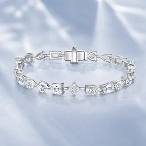 Macro view of sterling silver tennis bracelet with multi-shape moissanite diamonds