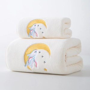 Detail of embroidered moon and rabbit on thick white coral fleece bath towel set