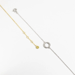 Detail shot of S925 sterling silver necklaces in gold and silver showing the hallmark tag
