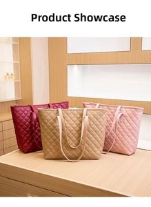 Three elegant quilted tote bags in burgundy, khaki, and pink on a wooden display