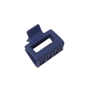 Detail of matte navy blue square hollow hair claw clip with sturdy multi-tooth design