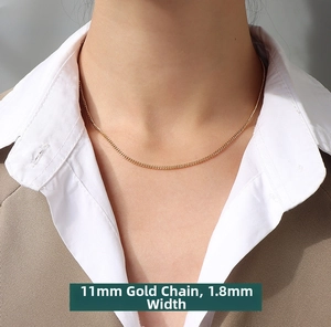 Detail of 1.8mm width gold plated titanium steel chain necklace on a model's neck