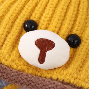 Winter knit baby bear hat with cute ears and warm fleece lining in bright ginger yellow