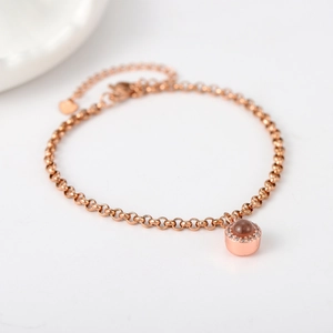 Rose gold projection bracelet with circular stone and micro-paved cubic zirconia accents