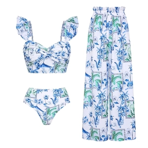 Three-piece beach set with tropical print top, high-waist bikini, and wide-leg trousers