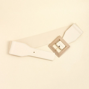 Women's wide elastic waist belt in cream with a textured gold square buckle