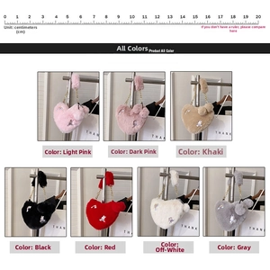 Macro detail of heart-shaped plush bags with rabbit patches and chain straps in 7 colors