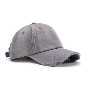 Distressed grey washed denim baseball cap with vintage frayed edges and a soft top design