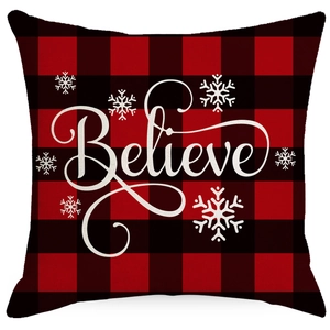 Christmas red and black buffalo plaid pillow cover featuring white Believe snowflake text