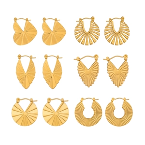 Detailed set of six golden geometric stud earrings featuring radial fan and heart patterns