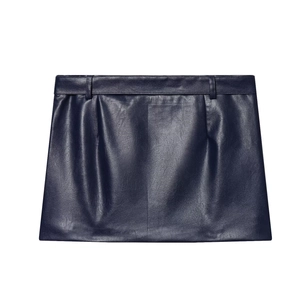 Detail of dark blue leather mini skirt featuring a professional A-line cut and fine texture