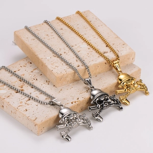Vintage stainless steel skull necklaces in gold, silver and gun grey on stone decor