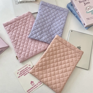 Close-up of quilted diamond pattern on colorful soft padded tablet inner storage bags