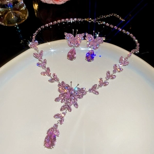 Exquisite pink zircon butterfly necklace and earrings set with shimmering star flare effects