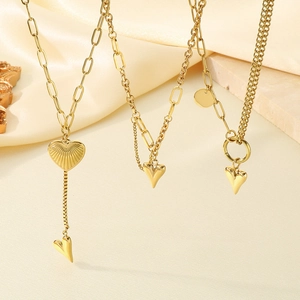 Three-piece gold heart necklace set with paperclip, box, and Cuban chains