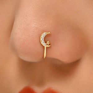 Detailed close-up of a gold S925 silver nose cuff featuring a moon and star diamond design