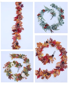 Detail of artificial autumn garland with silk maple leaves, pine cones and pumpkins