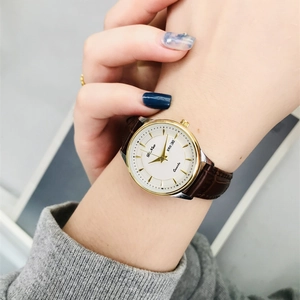 Elegant ladies quartz watch with gold case, white dial and brown leather strap