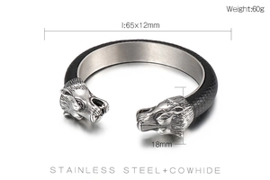 Macro shot showing dimensions and materials of lion head leather and stainless steel bracelet
