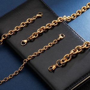 Hiphop golden stainless steel link chain bracelet set with lobster clasp on leather background