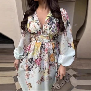 Floral print long dress with deep V-neck and long sleeves in elegant European interior