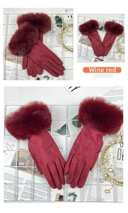 Close-up of wine red thermal gloves featuring thick faux fur cuffs and suede-like texture