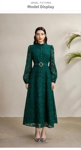 Detail of elegant dark green lace dress featuring a stand collar and matching belted waist