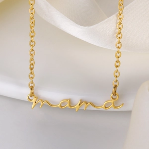 Minimalist gold Mama letter necklace for women displayed on white ceramic plate