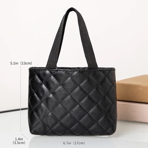 Detailed view showing the dimensions of the black quilted faux leather tote handbag