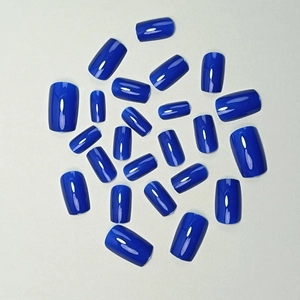 Deep blue glossy press-on nails in medium-long square shape with polished finish