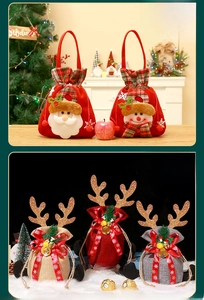 Detailed view of Christmas gift bags with Santa embroidery and sequined antlers