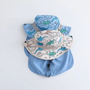 Kids dinosaur print sun hats with neck flaps in light blue and cream colors