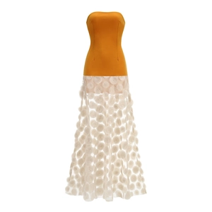 Detail of yellow tube top dress featuring white mesh skirt with 3D floral appliqués