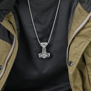 Vintage Mjolnir Thor's Hammer necklace in stainless steel worn by a male model